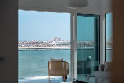 a room with a window with a view of the water at 3Bed Private Beach - Belle vie à La Vie Dubai in Dubai