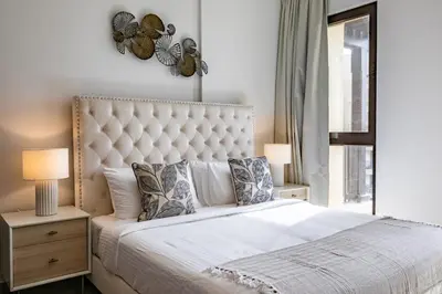 a bedroom with a large bed and a window at Apartment 1BDR in Madinat Jumeirah I Asayel 3 in Dubai
