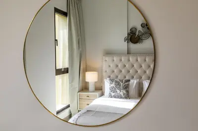 a bedroom with a bed and a mirror at Apartment 1BDR in Madinat Jumeirah I Asayel 3 in Dubai