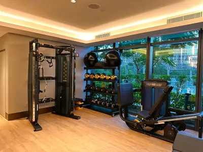 a fitness room with a gym with a simulator at THE CLOSEST building to Burj Khalifa with Fountain View in Address Opera Residence in Dubai