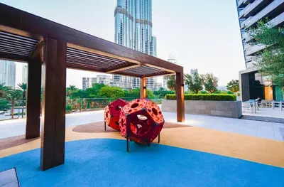 a red object is sitting on a blue carpet at THE CLOSEST building to Burj Khalifa with Fountain View in Address Opera Residence in Dubai