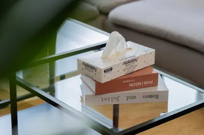 a stack of boxes sitting on top of a glass table at Elite Escape Holiday Home - 1 BHK Getaway with Dubai Mall Access - 1502 in Dubai