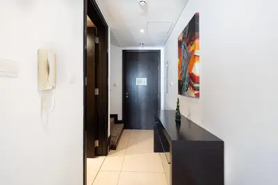 a hallway with a black counter and a black door at Whispers of the Wind by Lagom Vacation Homes in Dubai