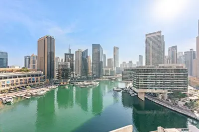 a view of a river with boats in a city at Silkhaus in Dubai Marina Heart, Opposite to Marina Mall in Dubai