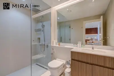a bathroom with a toilet and a shower and a sink at Mira Holiday Homes - Newly 1 bedroom with sea view in Dubai