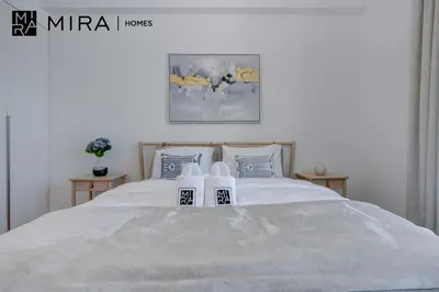 a bedroom with a bed with two towels on it at Mira Holiday Homes - Newly 1 bedroom with sea view in Dubai