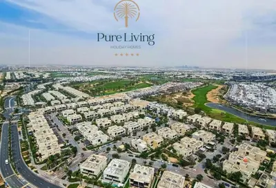 an aerial view of a large apartment complex at Damac Hills Carson C studio with full kitchenet - Ideal for monthly stay in Dubai