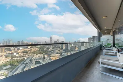 a balcony with a view of a city at HAVN - 2 Bedroom Apartment in Bloom Tower, JVC in Dubai