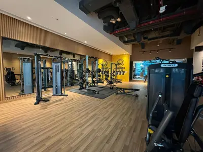 a gym with treadmills and machines in a room at Beachside Bliss: Stylish New Studio at Seven Palm in Dubai