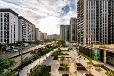 a street in a city with tall buildings at Upgraded Interior I Dubai Hills I City View I Socio Tower in Dubai