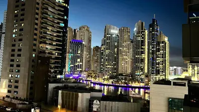 a view of a large city at night at Stay in heart of Dubai Marina, walk to JBR! #3 in Dubai