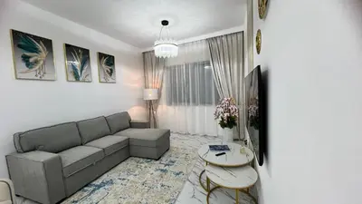 a living room with a couch and a table at Stay in heart of Dubai Marina, walk to JBR! #3 in Dubai
