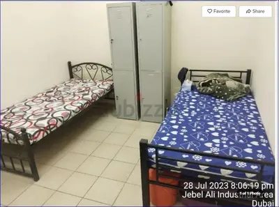 a small room with two beds in a room at Studio Flat in AWS only Bachelor no family no children in Dubai