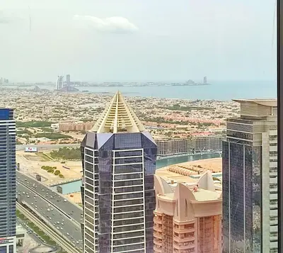 a view of a city from the top of a building at White Sage - Deluxe Apartment With Unobstructed Sea Views in Dubai