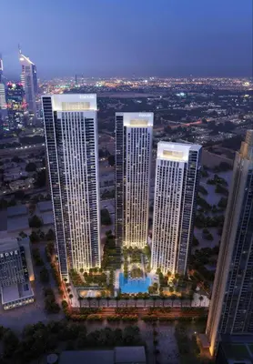 a group of tall buildings in a city at night at Downtown - 2BR Apartment with Burj Khalifa View in Dubai