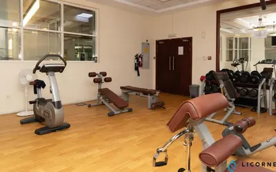 a gym with several exercise equipment in a room at Prime Spacious 2 BR Apt, Burj Khalifa & Canal View - Scala Tower in Dubai