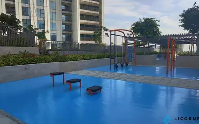 an empty playground with stools on a blue floor at Brand New Modern 2BR Retreat, Walk to Dubai Mall - Downtown Views ll in Dubai