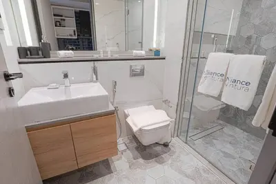 a bathroom with a toilet and a sink and a shower at Ravishing Studio at MAG 318, Business Bay in Dubai