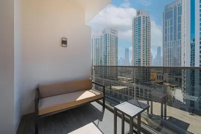 a bench on a balcony with a view of a city at Ravishing Studio at MAG 318, Business Bay in Dubai