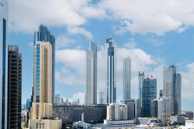 a group of tall buildings in a city at Ravishing Studio at MAG 318, Business Bay in Dubai