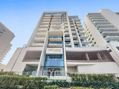a tall white apartment building with people in the window at Luxurious Studio in Westwood by Imtiaz - Al Furjan in Dubai