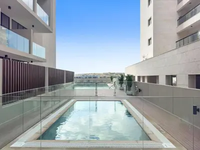 a swimming pool in the middle of a building at Luxurious Studio in Westwood by Imtiaz - Al Furjan in Dubai