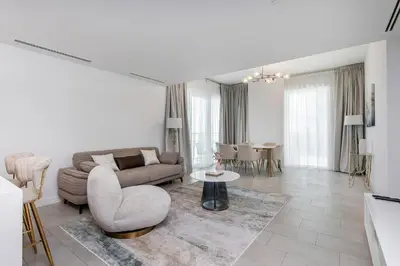 a living room with a couch and a table at Luxury apartments at La Vie in Dubai