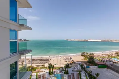a view of a beach and the ocean from a building at Luxury apartments at La Vie in Dubai