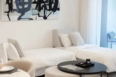 a living room with two beds and a coffee table at Forte Tower 1 - Fantastic Two Bedroom in Downtown Dubai in Dubai