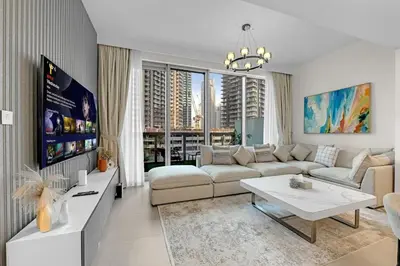 a living room with a couch and a table at 2 BR in Forte, Close to Dubai Mall with Pool and Gym in Dubai