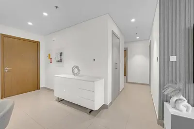 a bathroom with a white dresser in a room at 2 BR in Forte, Close to Dubai Mall with Pool and Gym in Dubai