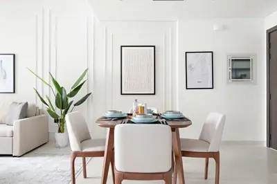 a dining room with a table and chairs at Silkhaus Sunset & Sea View in a Tower Private Beach in Dubai