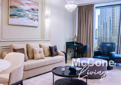 a living room with a couch and a table at Classic 1 Bed Suite in Burj Vista Tower, Downtown in Dubai
