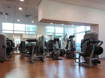 a gym with a bunch of exercise equipment in a room at Frank Porter - The Lofts West in Dubai