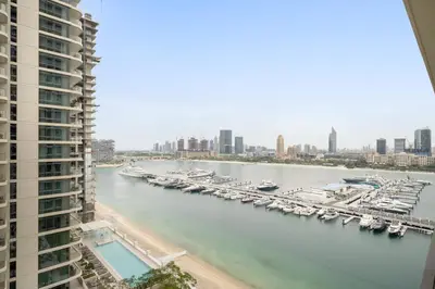 a view of a marina with boats in the water at Silkhaus Tower with Private Beach and Skyline Views in Dubai