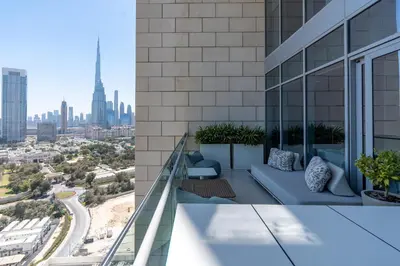 a view of the city from the balcony of a building at Burj Daman, DIFC Dubai - Mint Stay in Dubai