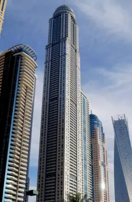 a tall building in a city with many tall buildings at Stunning Marina View! CoLiving Rooms in Princess Tower Marina in Dubai