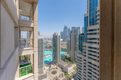 an aerial view of a city with tall buildings at Central 1BR with Downtown Fountain Views in Dubai