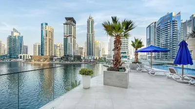 a balcony with a view of a city skyline at Sophisticated 1 Bed Suite in Dubai Marina in Dubai