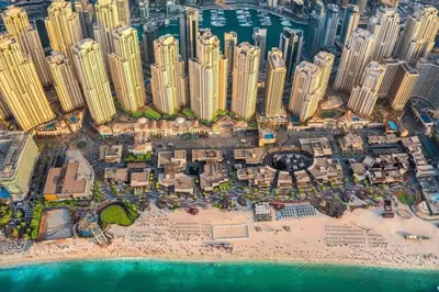 an aerial view of a resort on a beach at Upgraded 3BR Jacuzzi & Comfort at JBR in Dubai
