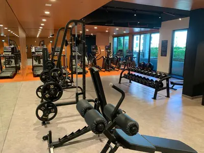 a gym with a bunch of treadmills and machines at les voiles in Dubai