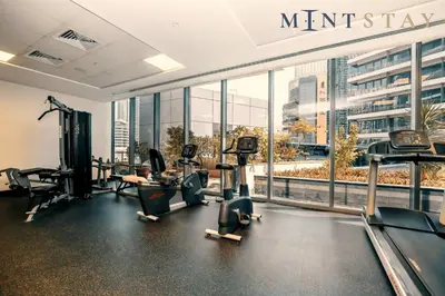 a gym with treadmills and cardio equipment in a building at Silverene Tower B, Dubai Marina - Mint Stay in Dubai