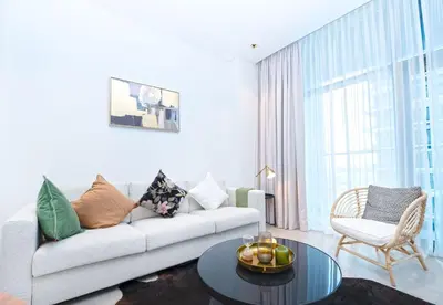 a living room with a couch and a table at EasyGo - Northside Tower 2 Canal View in Dubai