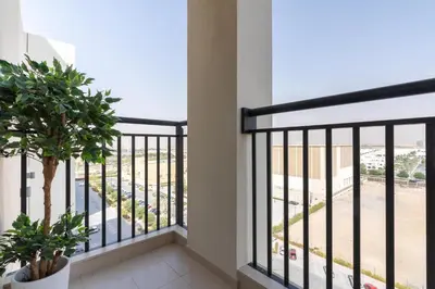 a balcony with a view of a street at UrbanHomes - Exceptional 2 Bedroom Apt in A Family Friendly Neighborhood in Dubai