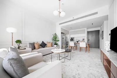 a living room with a couch and a table at Silkhaus Full Marina View 2BDR in Unique New Tower in Dubai