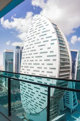 a view of a building on top of a glass table at Perfect Studio Apartment Near to Metro Station in Dubai