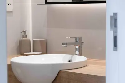 a bathroom with a white sink and a toilet at Veluxa - Fantastic 1 Bed - in Jumeirah Golf Estate! in Dubai