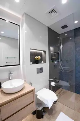 a bathroom with a white sink and a shower at Veluxa - Fantastic 1 Bed - in Jumeirah Golf Estate! in Dubai