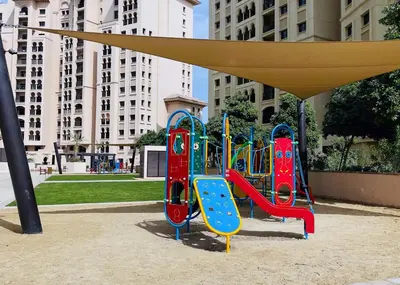 a playground with a slide in a park at Veluxa - Fantastic 1 Bed - in Jumeirah Golf Estate! in Dubai