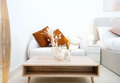 a coffee table in a living room with a couch at EasyGo - Azizi Riviera 15 Community View in Dubai